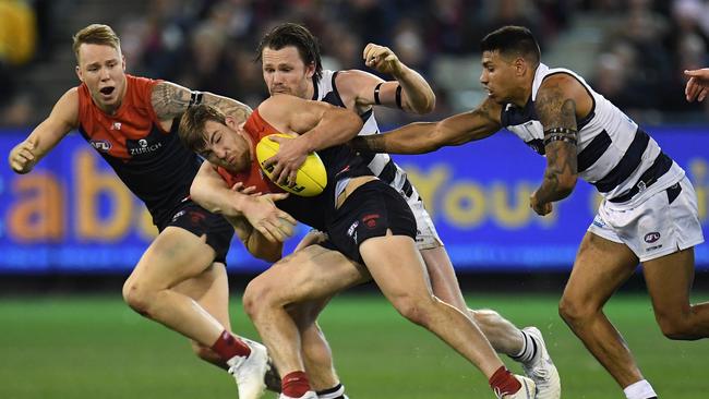 Jack Viney (second from left) and Patrick Dangerfield (third from left) contest the ball during last week’s game. Picture: AAP Image/Julian Smith