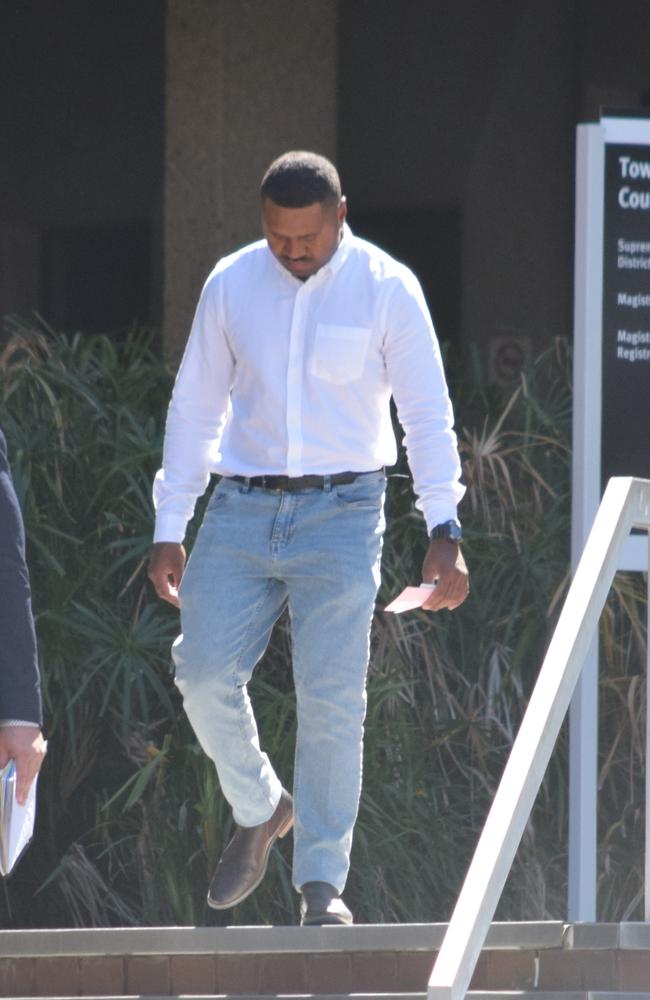 Sean Ladi Suk (centre), 22, leaves court after being sentenced for seven counts of stalking.