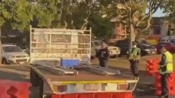 A man has been fined $4000 and charged with multiple offences after growing frustrated trying to re-enter Queensland and running through the border barricades. Picture: 9 News