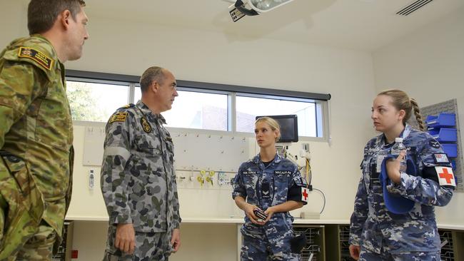 Australian Defence Force health professionals discuss the day's schedule in the North West Regional Hospital. Picture: SUPPLIED