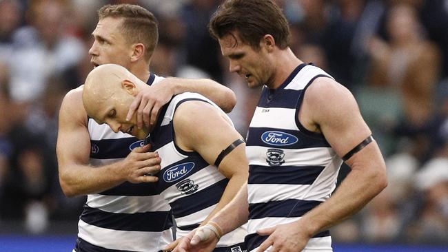 Gary Ablett, centre, with Joel Selwood and Patrick Dangerfield during Geelong’s win over Hawthorn. Picture: AAP