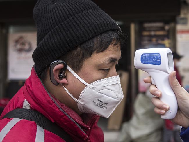 A man getting his temperature checked in Hubei Province, Wuhan. Picture: Getty Images