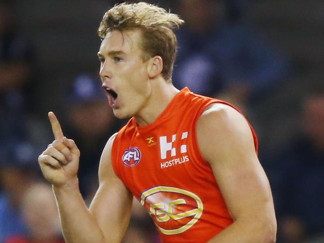 MELBOURNE, AUSTRALIA - APRIL 15:  Tom Lynch of the Suns celebrates a goal during the round four AFL match between the Carlton Blues and the Gold Coast Suns at Etihad Stadium on April 15, 2017 in Melbourne, Australia.  (Photo by Michael Dodge/Getty Images)