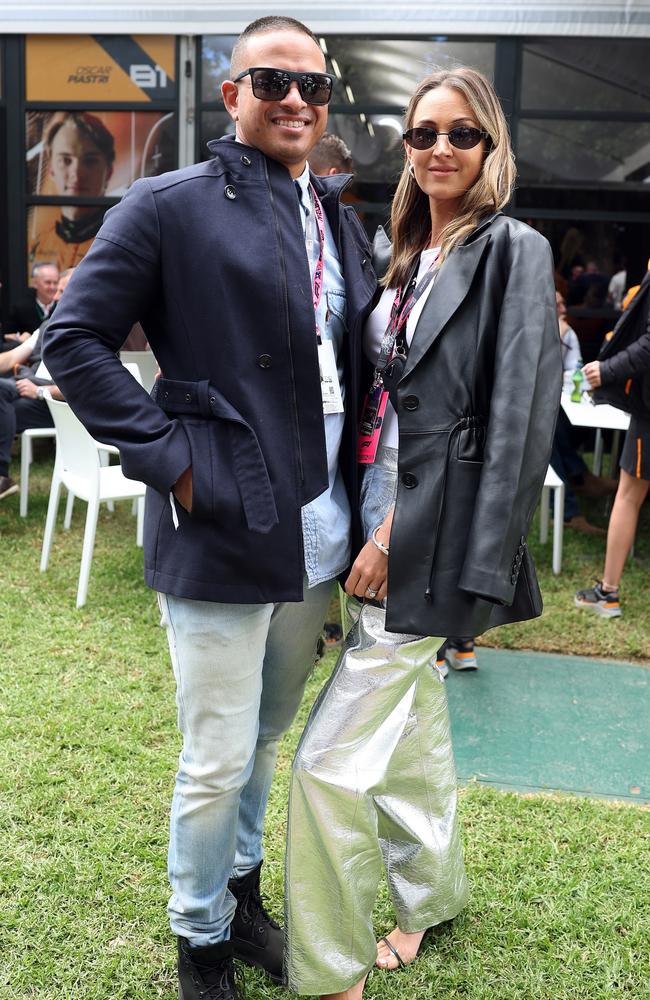 Usman Khawaja and wife Rachel Khawaja pose for a photo in the Paddock at the Australian F1 Grand Prix. Picture: Robert Cianflone/Getty Images