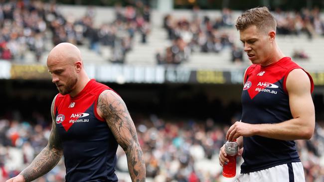 Nathan Jones and Jake Melksham walk dejectedly off the MCG. (Photo by Michael Willson/AFL Media/Getty Images)