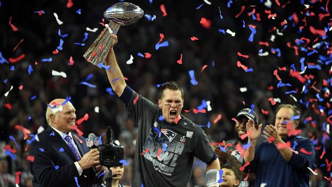 Tom Brady #12 of the New England Patriots holds the Vince Lombardi Trophy.