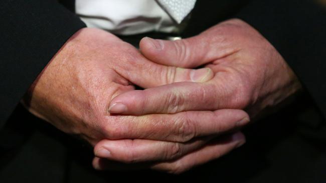 The hands of a spokesman for Maurice Van Ryn’s victim’s families. Picture: David Moir