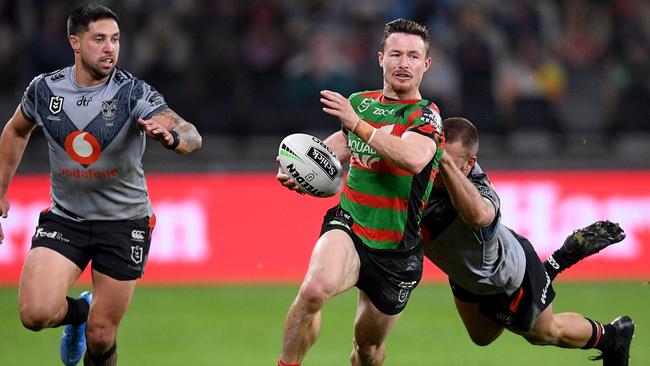 Damien Cook of the Rabbitohs is tackled by Karl Lawton of the Warriors during the the Round 6 NRL match between the South Sydney Rabbitohs and the New Zealand Warriors at Bankwest Stadium in Sydney, Friday, June 19, 2020. (AAP Image/Dan Himbrechts) NO ARCHIVING, EDITORIAL USE ONLY