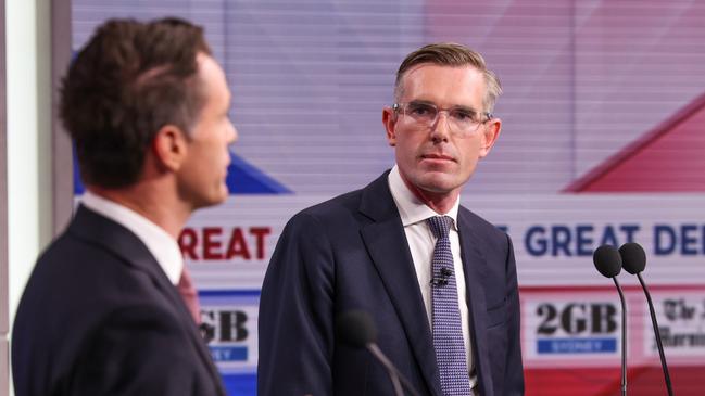 Premier Dominic Perrottet listens to Labor leader Chris Minns during the NSW leaders debate in Sydney on Wednesday. Picture: Toby Zerna / NCA NewsWire