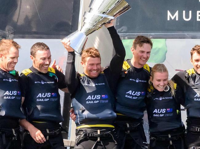 Australia SailGP Team with driver Tom Slingsby celebrates with Champagne and the trophy after winning the Mubadala SailGP Season 3 Grand Final in San Francisco, California, on May 7, 2023. (Photo by Josh Edelson / AFP)