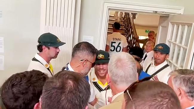 Usman Khawaja and Dave Warner in dispute with several MCC Members in the Long Room at Lords during the lunch break.