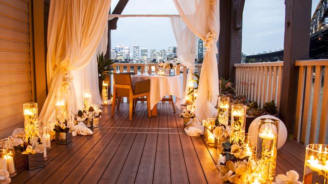 Joshua and Michelle share an intimate dinner with views of the Harbour Bridge. Photo credit: Leigh Hope at www.shootmyfamily.com.au.