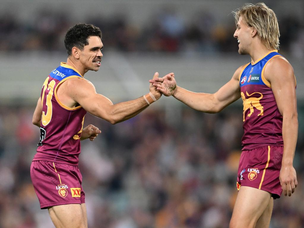 Kai Lohmann (right) celebrates a goal with his Brisbane teammate Charlie Cameron. Picture: Matt Roberts/AFL Photos/via Getty Images