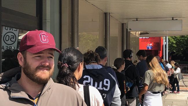 Tom Crerar,28, of Allambie Heights, waits in a two-hour queue outside the Centrelink office at Brookvale so he can sign on for Federal Government financial assistance after losing his job because of COVID-19 shutdown. Picture: Jim O'Rourke