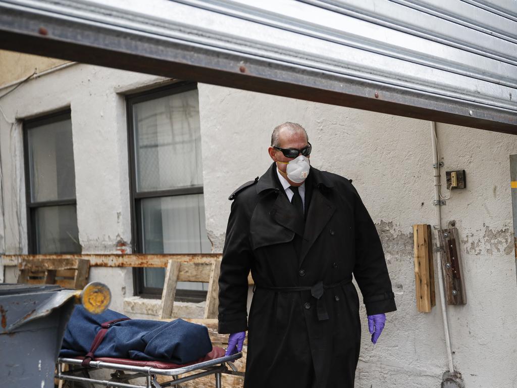 Funeral director Tom Cheeseman collects a body from a nursing home in the Brooklyn borough of New York. Picture: AP