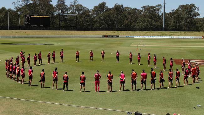 Perth Scorchers and Sydney Sixers players form a barefoot circle before a WBBL match in Sydney last year Picture: Getty Images