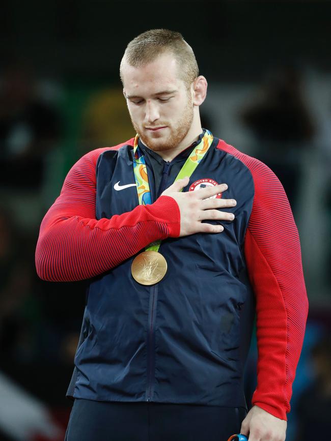 USA's gold medallist Kyle Frederick Snyder stands on the podium with his gold medal. AFP PHOTO / Jack GUEZ.