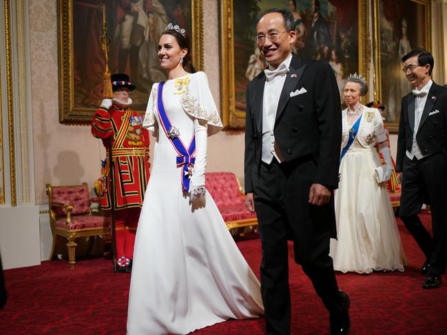 Catherine and Choo Kyung-ho, Deputy Prime Minister of South Korea, followed by Princess Anne and guests at the State Banquet at Buckingham Palace. Picture: Getty Images