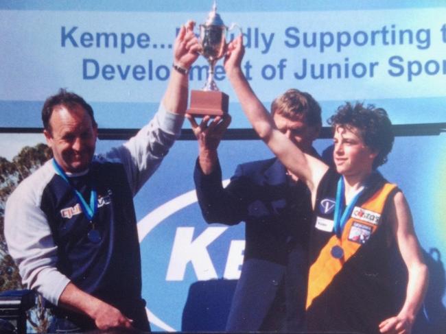 Travis Boak pictured with dad Roger, who coached the Torquay under-14s side to a premiership, with Boak captain and best on ground that day.