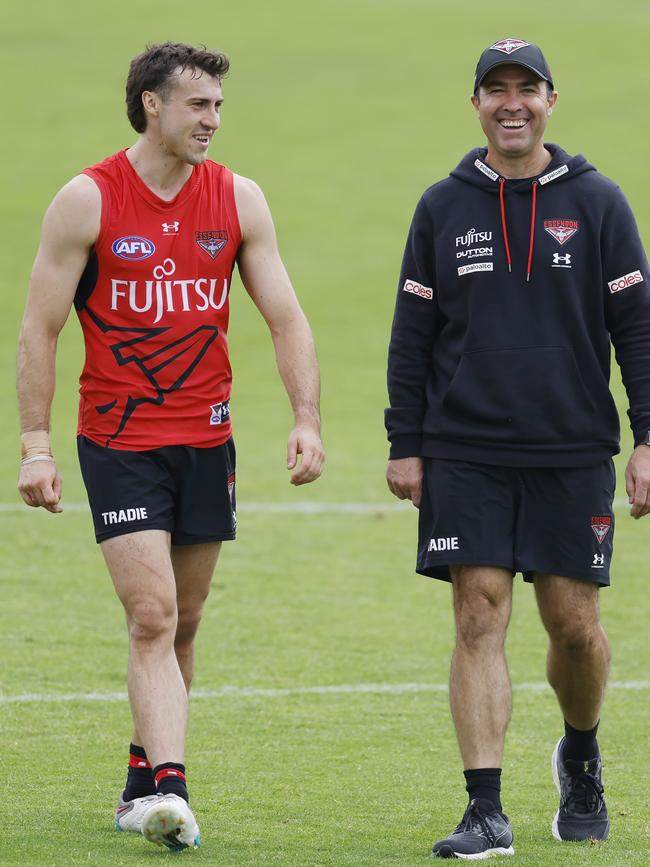 Brad Scott, senior coach of the Bombers shares a laugh with Andrew McGrath during training in February. The vice-captain was the instigator of the off-season, player-led Arizona trip. Picture: Michael Klein