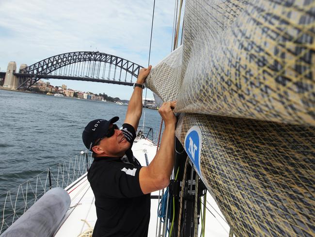 Investec Loyal Sydney Hobart Yacht Race crew training on their maxi yacht ahead of the 2011 race on Sydney Harbour. Former Wallabies rugby player Phil Kearns.