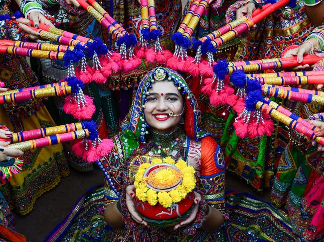 Women wear traditional dresses to perform at a Garba dance rehearsal ahead of the Hindu festival 'Navratri' in India. Picture: Sam Panthaky/AFP