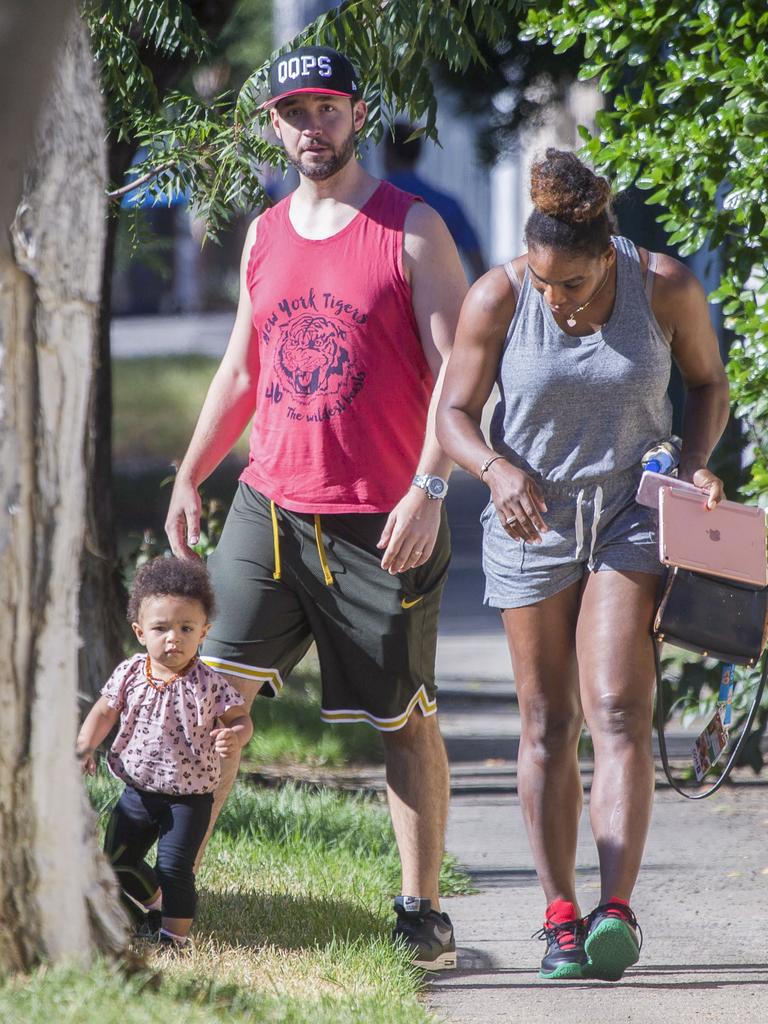 Serena Williams and her husband Alexis Ohanian enjoy an afternoon walk with their 1-year-old daughter Alexia Olympia. Serena's daughter looked seriously cute, toddling her way down the footpath, wearing Nike sneakers like her Mummy. Picture: MediaMode