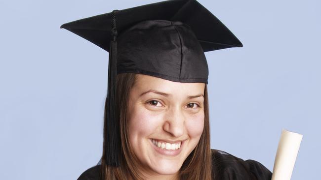 Thinkstock. Woman wearing graduation hat and gown. Graduate. Generic image.