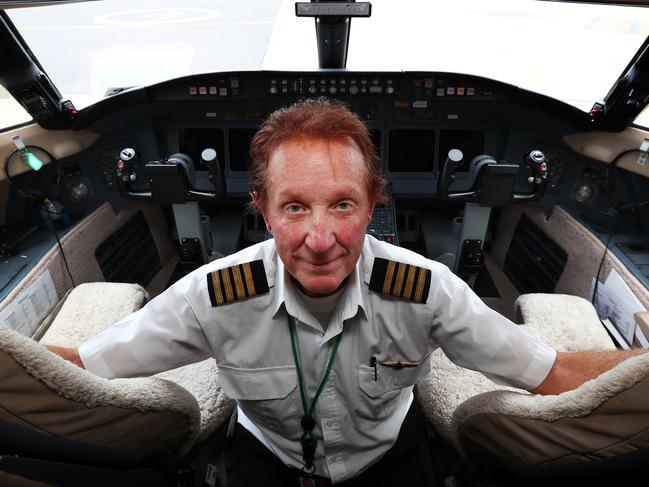 30/11/16: Byron Bailey demonstrating the key features in the cockpit of an aircraft which go to the argument about what happened to MH370. John Feder/The Australian.