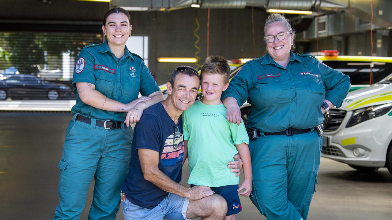 Jason with his son Aiden, the Triple-zero call taker Alecia Williams and Extended Care Paramedic Mel Alexander who saved his life Picture: Mark Brake