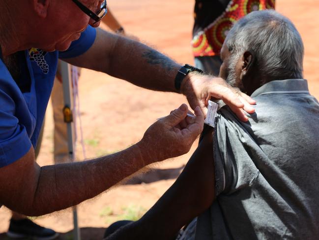 A supplied image of Beagle Bay community member receives a coronavirus vaccine in the remote Aboriginal community of Beagle Bay in the Kimberley region, WA, Tuesday, March 30, 2021. Beagle Bay is the first remote community in WA to receive the vaccines. Tuesday, March 30, 2021,  (AAP Image/Supplied by Kimberley Aboriginal Medical Services) NO ARCHIVING, EDITORIAL USE ONLY