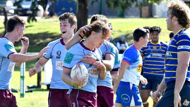 Norths player Tyler Fleming get the congratulations after a try Colts 1 rugby match between Norths and Easts. Saturday May 29, 2021. Picture, John Gass