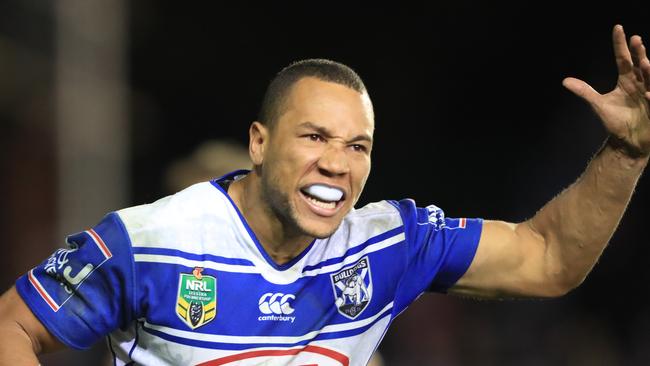 Moses Mbye celebrates his matchwinning try for the Bulldogs. Pic Mark Evans