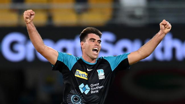 BRISBANE, AUSTRALIA - JANUARY 10: Xavier Bartlett of the Heat celebrates dismissing Jhye Richardson of the Scorchers with the last ball of the match during the BBL match between the Brisbane Heat and the Perth Scorchers at The Gabba, on January 10, 2024, in Brisbane, Australia. (Photo by Albert Perez/Getty Images)