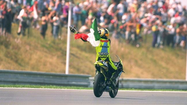 Valentino Rossi celebrates his first win in 1996. Pic: Mark Thompson/Allsport