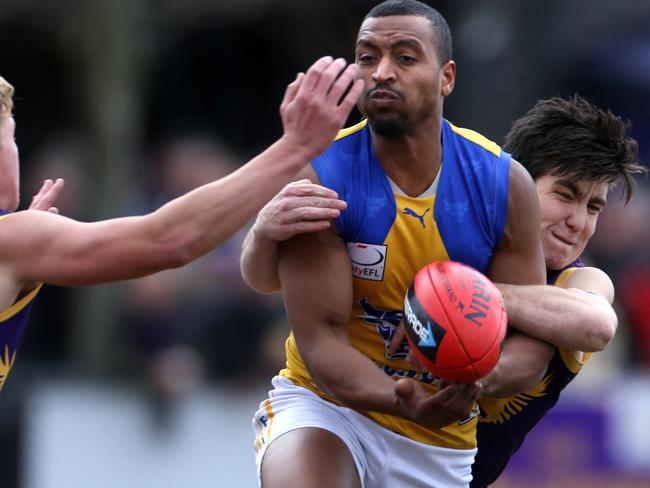 EFL (division 1) footy: Vermont v Noble Park.Zig Alwan with the ball for Noble Park and 25 Sam Wadleyfor Vermont tackles.Picture: Stuart Milligan