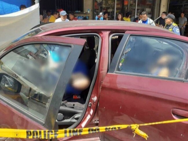 The red Mitsubishi Mirage following the shooting. Picture: Twitter/@zhandercayabyab/Raoul Esperas