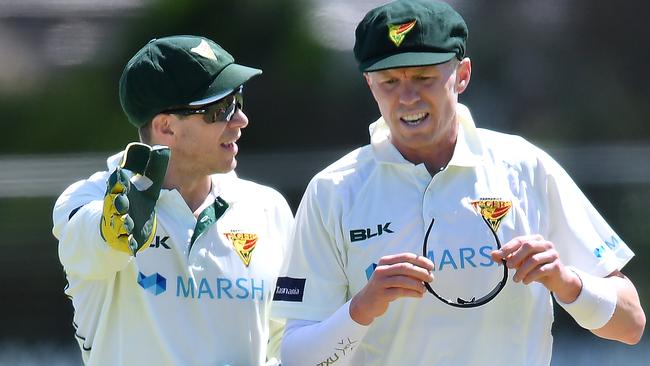 Tim Paine of the Tasmanian Tigers chats to Peter Siddle of the Tasmanian Tigers during day two of the Sheffield Shield match between Queensland and Tasmania at Park 25 on October 11, 2020 in Adelaide, Australia. (Photo by Mark Brake/Getty Images)