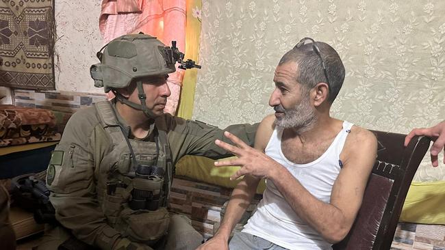 Qaid Farhan Al-Qadi with 162nd Division commander Brigadier General Itzik Cohen after his rescue at an undisclosed location in the southern Gaza Strip. Picture: AFP