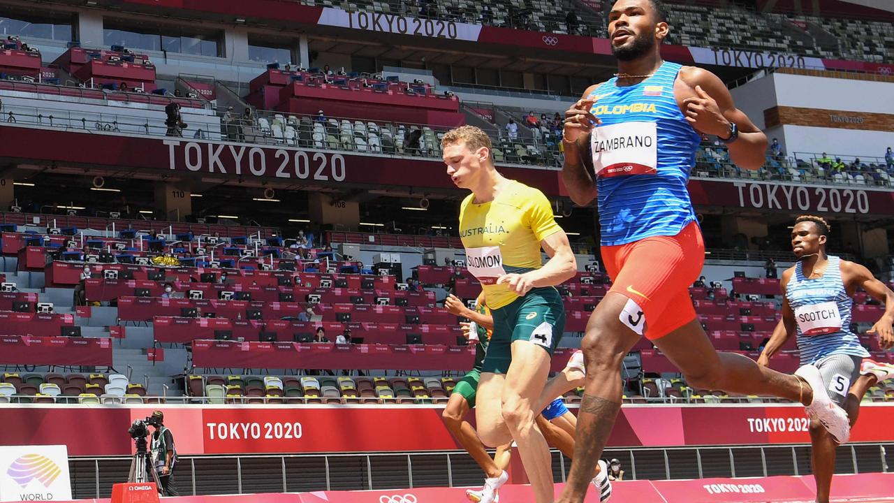 Colombia's Anthony Jose Zambrano (R) crosses the finish line to win ahead of second-placed Australia's Steven Solomon (L) in the men's 400m heats. Picture: Jewel Samad/AFP