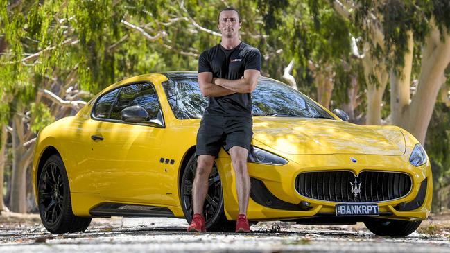 Bullish Bitcoin investor Kane Ellis with the $200,000 Maserati — complete with ironic number plates — that he bought with his profits. Picture: Roy VanDerVegt