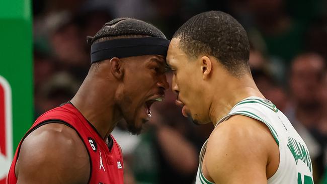 Jimmy Butler #22 of the Miami Heat exchanges words with Grant Williams #12 of the Boston Celtics during the fourth quarter in game two of the Eastern Conference Finals at TD Garden on May 19, 2023 in Boston, Massachusetts. NOTE TO USER: User expressly acknowledges and agrees that, by downloading and or using this photograph, User is consenting to the terms and conditions of the Getty Images License Agreement. (Photo by Adam Glanzman/Getty Images)