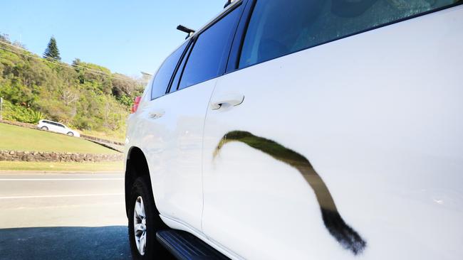 One of several Queensland Registered vehicles which had been vandalised with black spray paint at Duranbah Beach Tweed Heads close to the NSW / Queensland Border. Photo: Scott Powick NEWSCORP