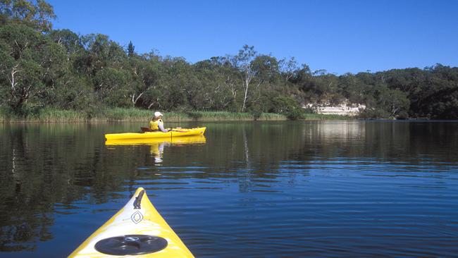 Kayakers paddling on the Glenelg River.