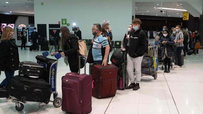 Passengers lining up for flights at Melbourne Airport on Sunday. Picture: Tony Gough