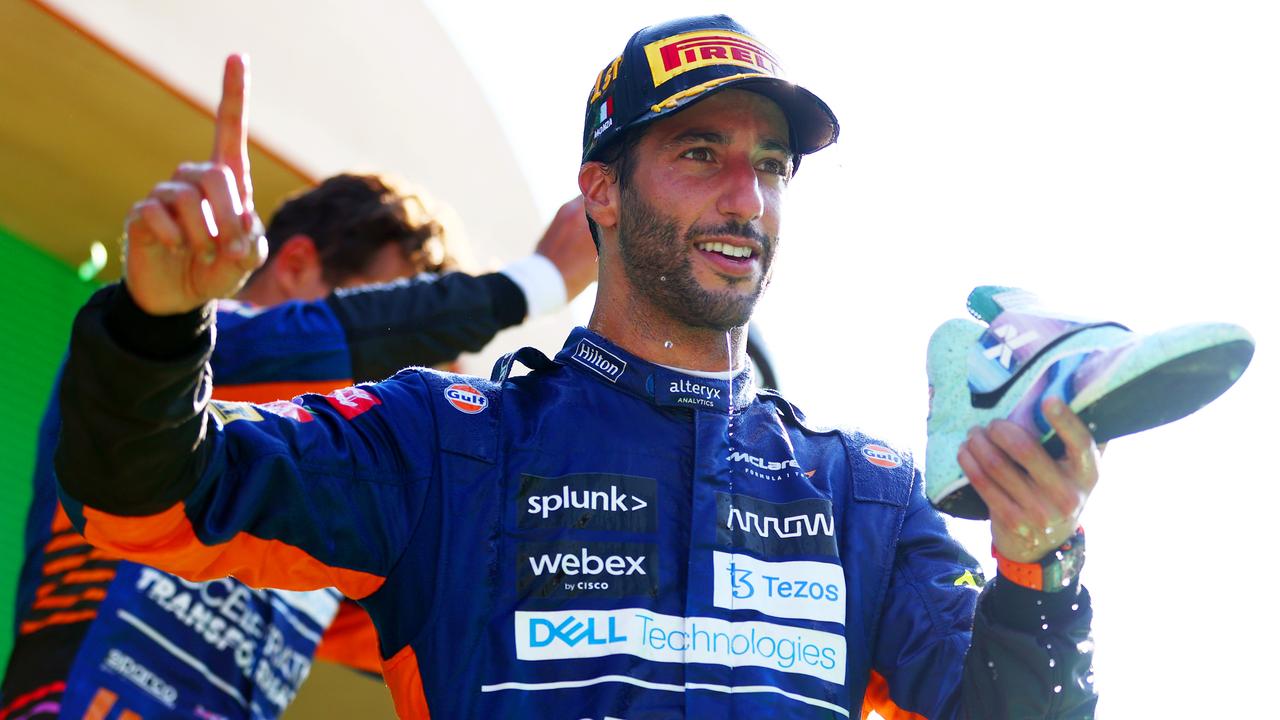 MONZA, ITALY - SEPTEMBER 12: Daniel Ricciardo of Australia and McLaren celebrates with a shoey on the podium after winning the F1 Grand Prix of Italy at Autodromo di Monza on September 12, 2021 in Monza, Italy. (Photo by Dan Istitene - Formula 1/Formula 1 via Getty Images)