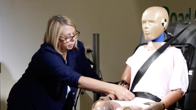 Transurban Road Safety Centre joint director, Professor Julie Brown, prepares a crash test dummy for testing using the driver cushions sometimes used by older drivers. Picture: File