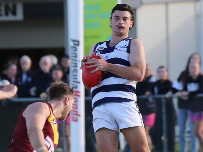 Luke Daniel takes a mark for Pearcedale. Picture: Doug Farr