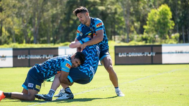 Jesse Arthars (right) makes a tackle at training. Picture: Gold Coast Titans