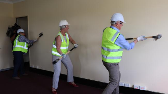 DEMOLITION COMMENCES: Capricornia MP Michelle Landry, Rockhampton region mayor Margaret Strelow and Deputy Prime Minister Michael McCormack demolish the building to make way for the new art gallery.